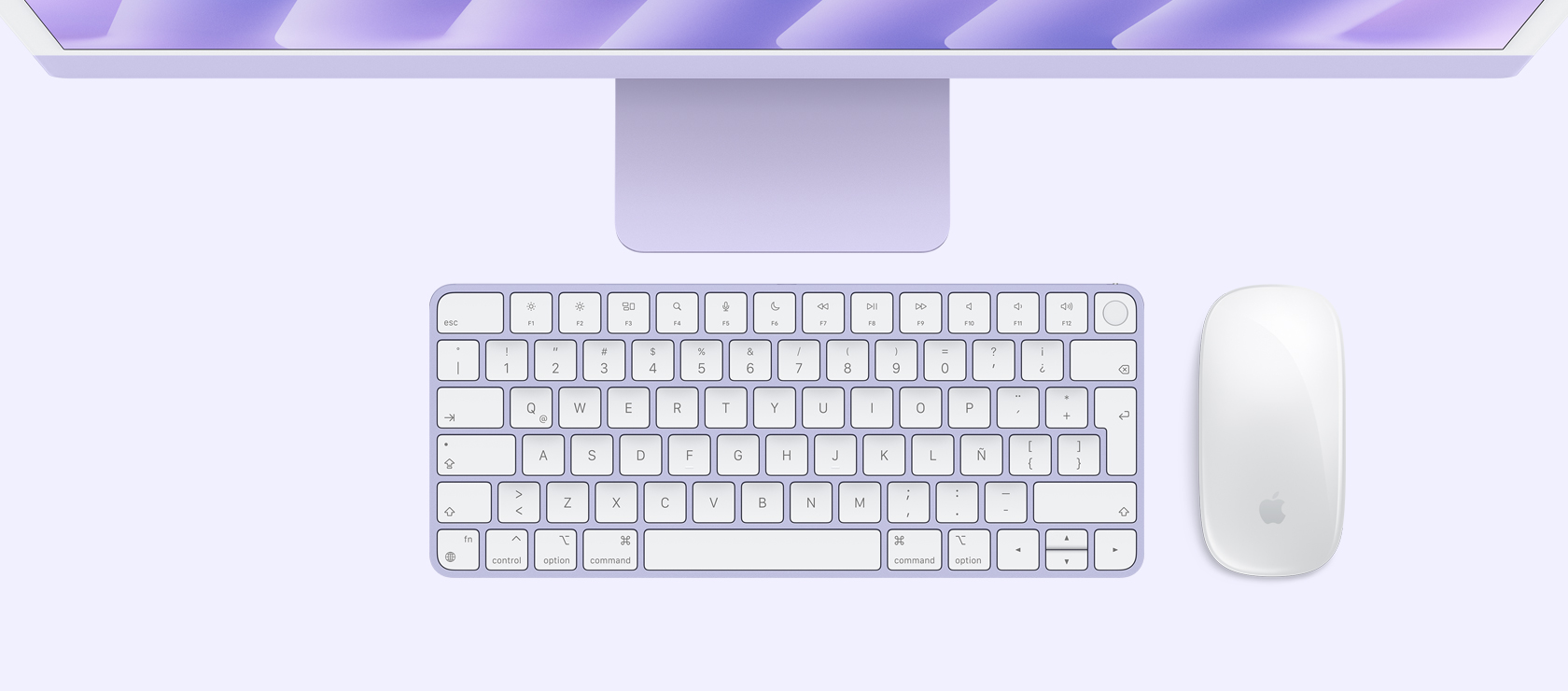 Vista panorámica de un iMac morado con mouse y teclado a juego