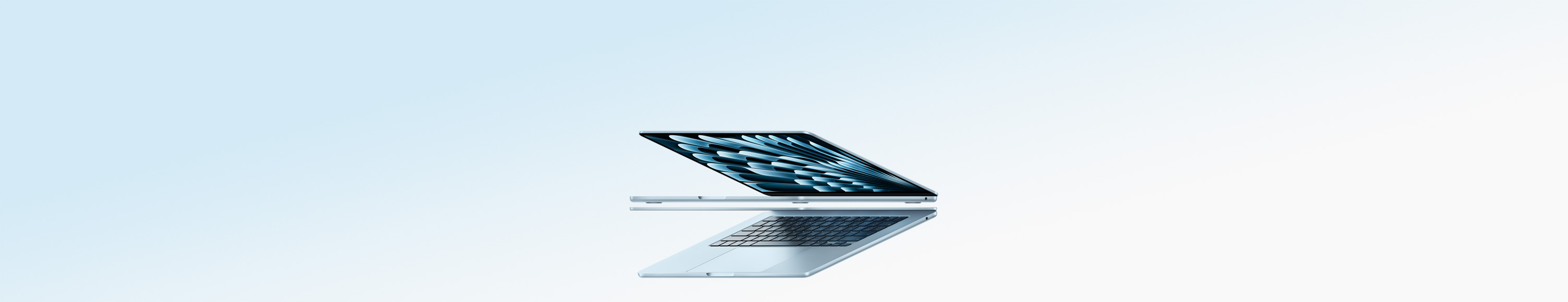 Due MacBook Air celesti aperti, che riproducono la forma di una freccia, per evidenziare il profilo sottile