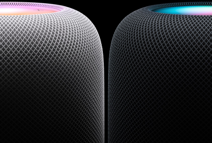 Un HomePod blanco y otro de color medianoche colocados uno al lado del otro